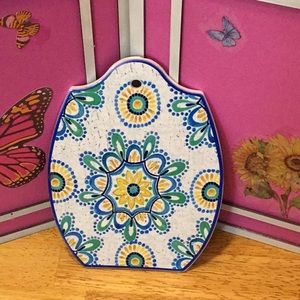 Ceramic tile wall hanging.